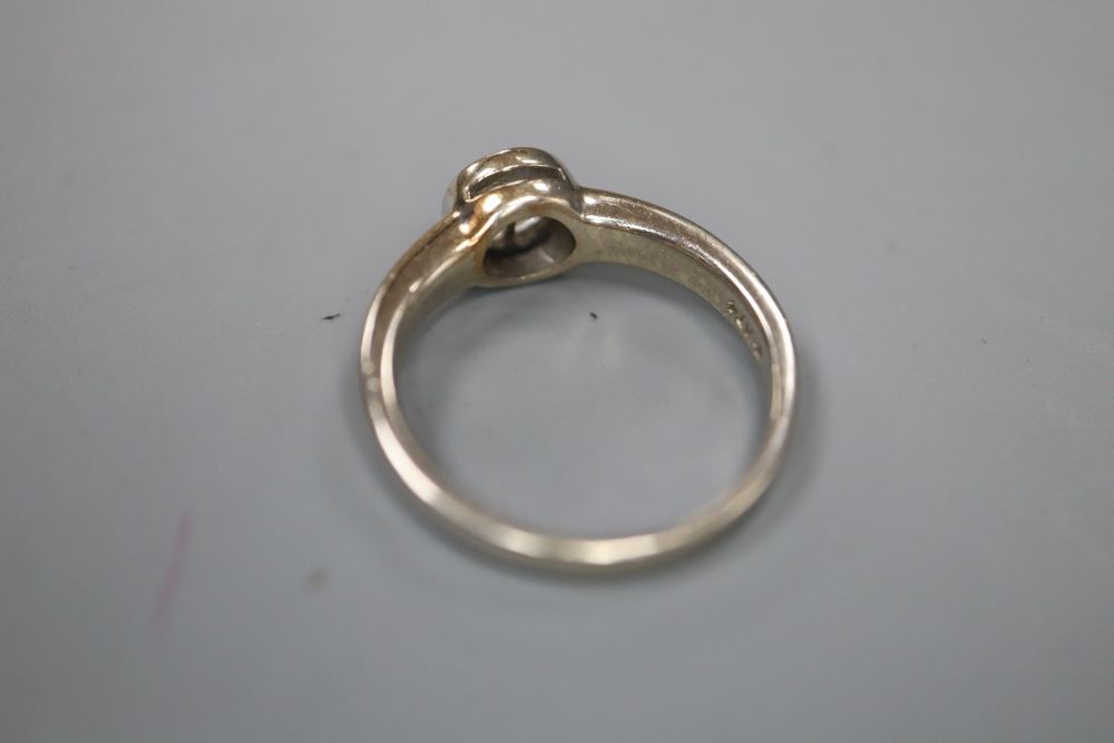 A modern 14k white metal and two stone diamond ring (split solitaire), size P, gross 4.4 grams.